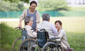 A group of caregivers and senior adults having a good conversation.
